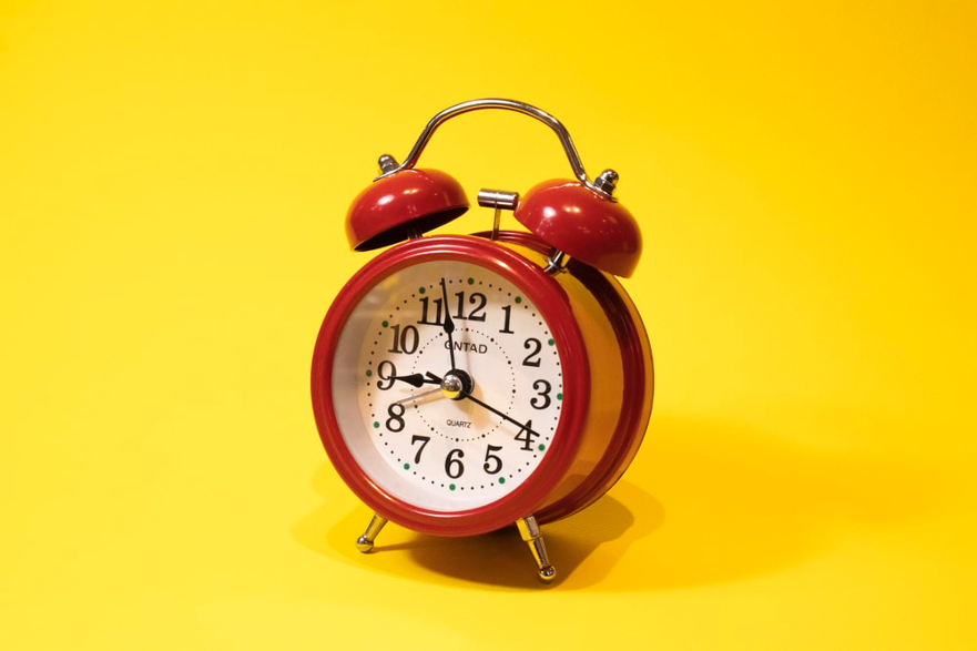 Time's up! A red alarm clock is ready to sound