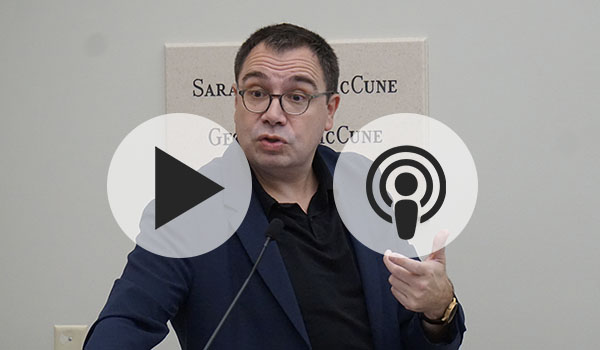 Perreau speaking at a podium